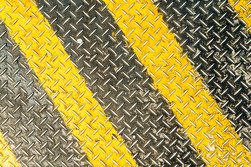 diamond metal plate  background with yellow line