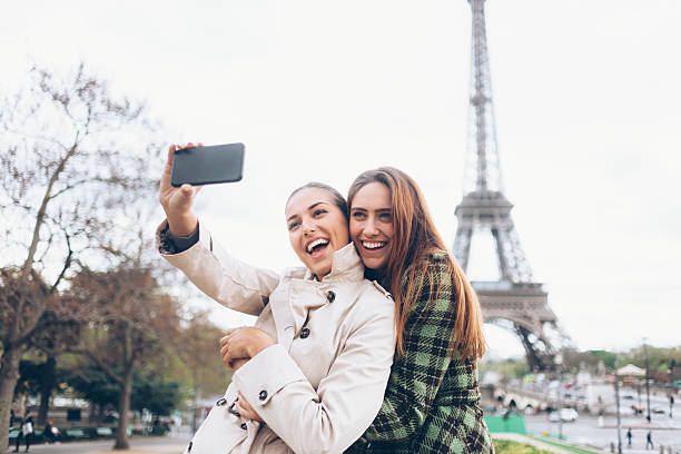 istock Laughing young women making selfie at Eiffel tower 535416524
