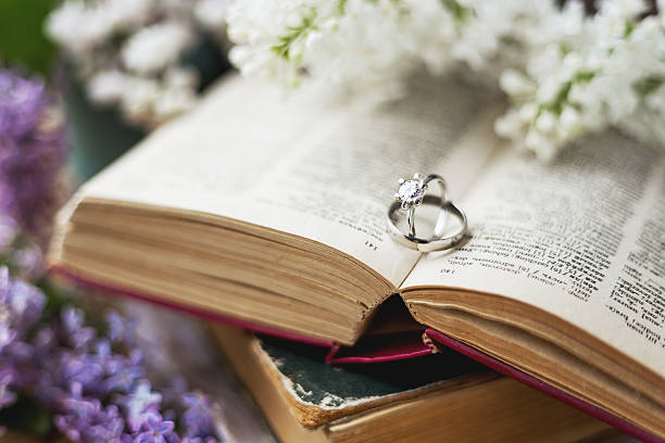 Pair of wedding rings with diamond. Rustic background