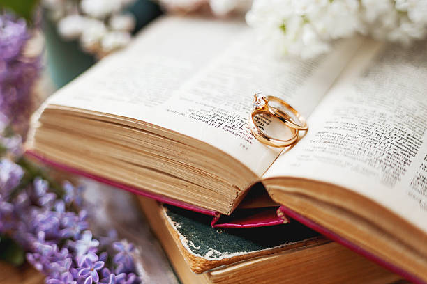 istock Pair of wedding rings with diamond. Rustic background 535416980