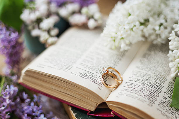 istock Pair of wedding rings with diamond. Rustic background 535417036