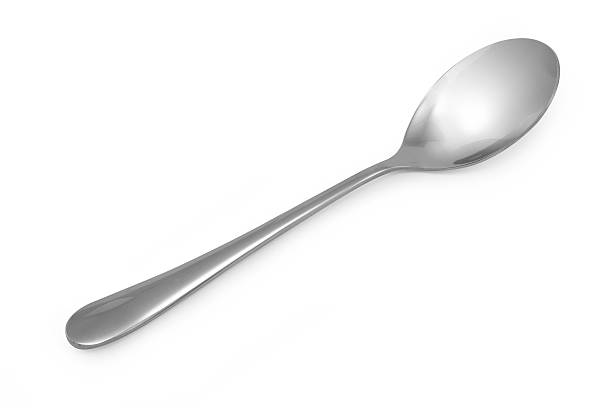 istock Stainless steel glossy metal kitchen spoon isolated 535419190