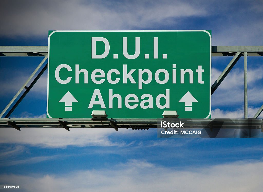 D.U.I. Checkpoint Ahead A road sign concept that says "D.U.I. Checkpoint Ahead." Security Barrier Stock Photo
