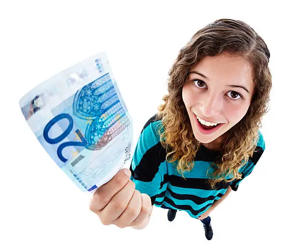 An exaggerated high-angle view of a delighted and beautiful young woman looking up, smiling and holding up a 20 Euro note. Isolated on white. Fish-eye lens exaggerates the perspective.