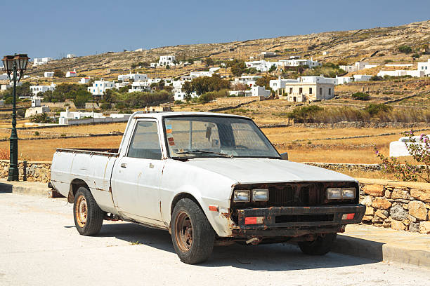 Old rusty car on Greek island Mykonos.
