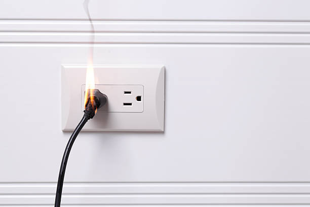 Electric Fire Electric plug on fire overheated photos stock pictures, royalty-free photos & images