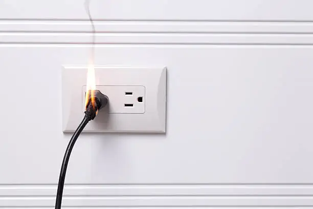Electric plug on fire