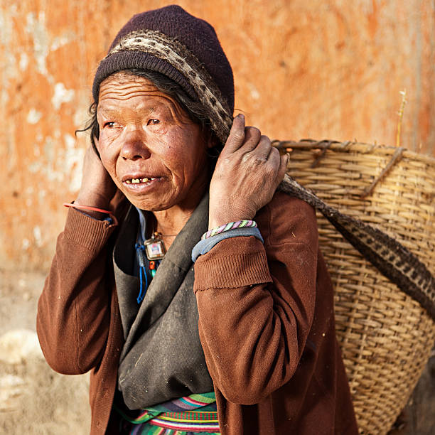 istock Tibetan woman carrying basket 535420147
