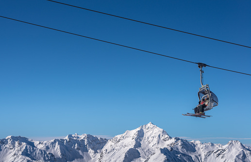 Chair Lift used by Skier in Winter