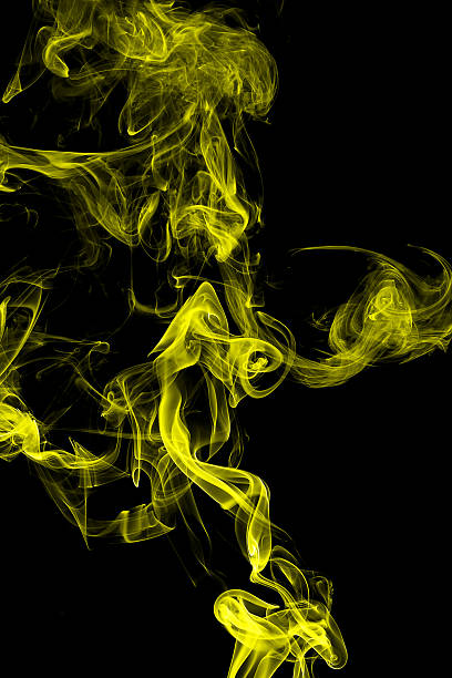 istock Abstract yellow smoke on black background 535420786