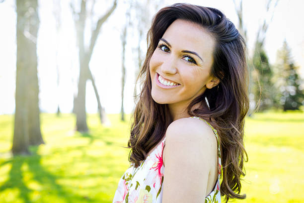 young brunette wearing summer outfit outdoors