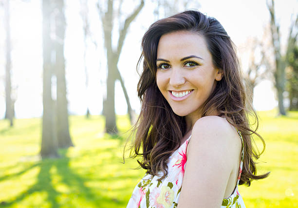 young brunette wearing summer outfit outdoors