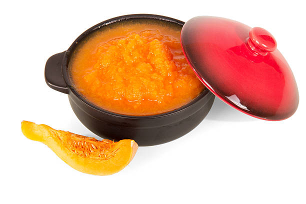 istock Pumpkin puree in  pan isolated on white background. 535422512