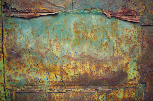 Rusty grunge green crumpled empty shiny sheet metal wall texture background