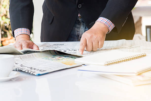 istock Businessman with Newspaper. 535426110