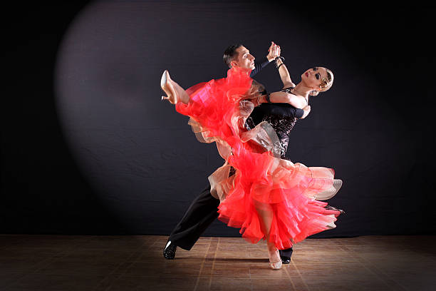 istock dancers in ballroom isolated on black background 535426594