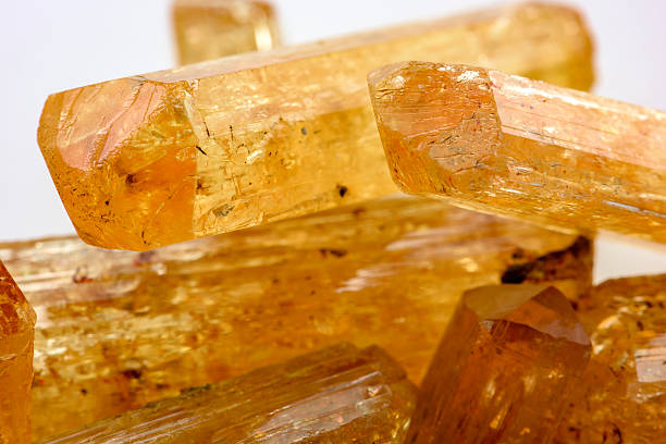 Uncut Imperial Topaz Imperial topaz crystals with their color, texture and formation characteristics topaz stock pictures, royalty-free photos & images