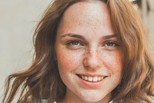 beautiful  happy young woman  hipster portrait face  with freckles and smile