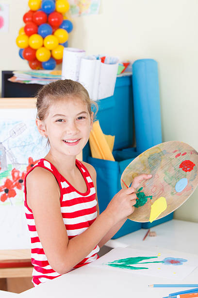 istock Smiling Schoolgirl drawing 535428375