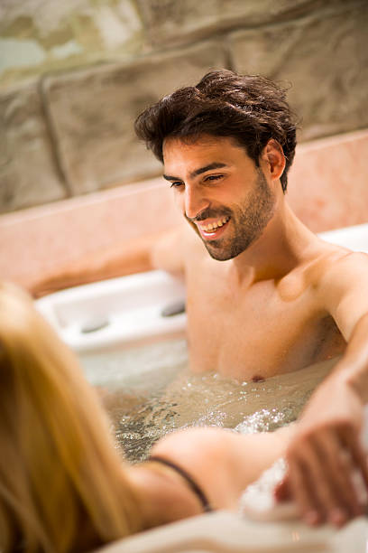 istock Young man with his girlfriend in hot tub. 535429321