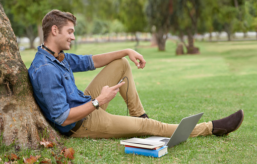 Shot of a handsome young man studying in the park with a laptophttp://195.154.178.81/DATA/i_collage/pi/shoots/782828.jpg