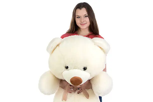 Photo of Teenage girl holding teddy bear