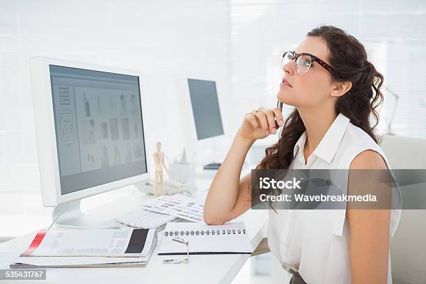 Serious Businesswoman Sitting And Thinking Stock Photo - Download Image Now - 20-24 Years, 20-29 Years, 2015