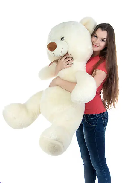 Photo of Standing teenage girl with teddy bear