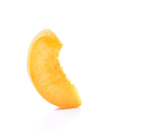 istock Yellow peach,Peach cut pieces  on white background. 535444198