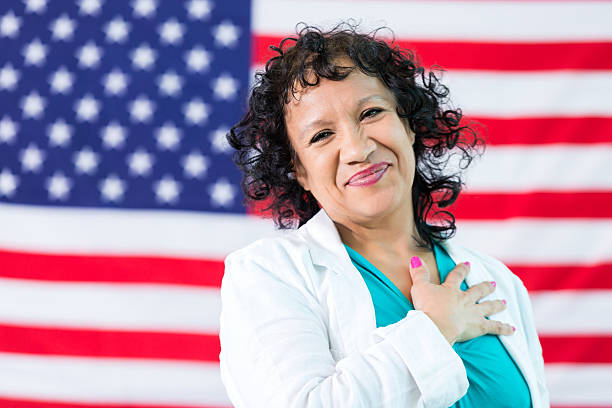 istock Hispanic Woman hand over heart 535446560
