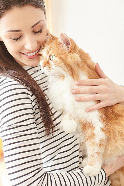 istock Cheerful girl is hugging her lovely pet 535447052