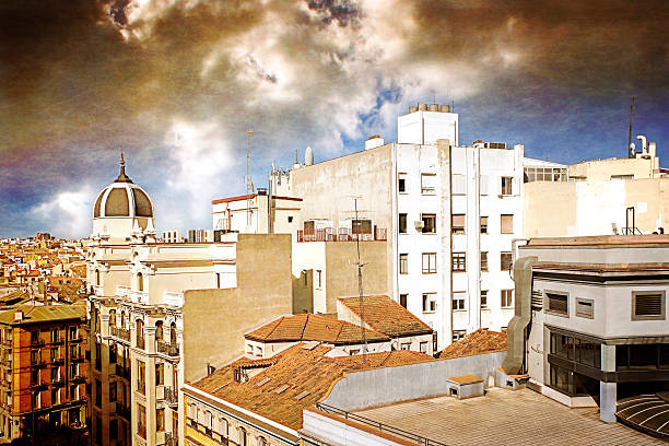 Madrid textured roof and cloudy sky.