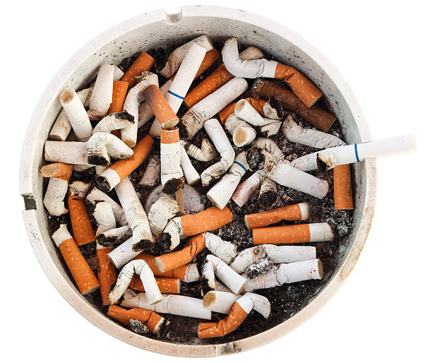 istock Dirty disgusting burnt cigarette filled ash tray, clipping path 535448416