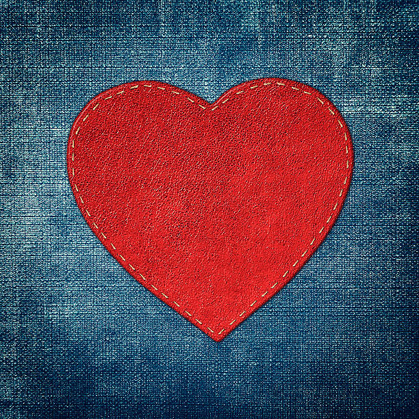 istock red leather heart on fabric in grunge style 535449649