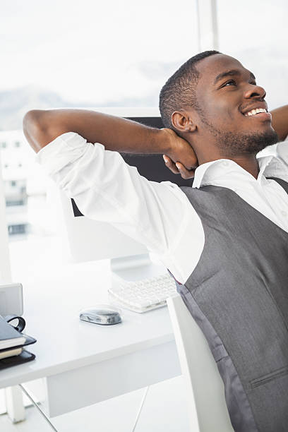 istock Relaxed businessman with hands behind head 535450081