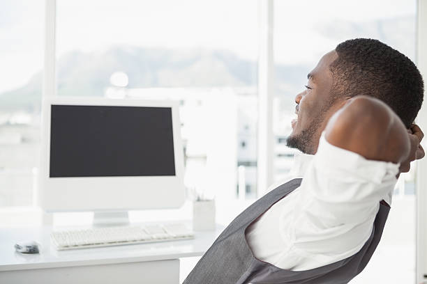 istock Relaxed businessman with hands behind head 535450083
