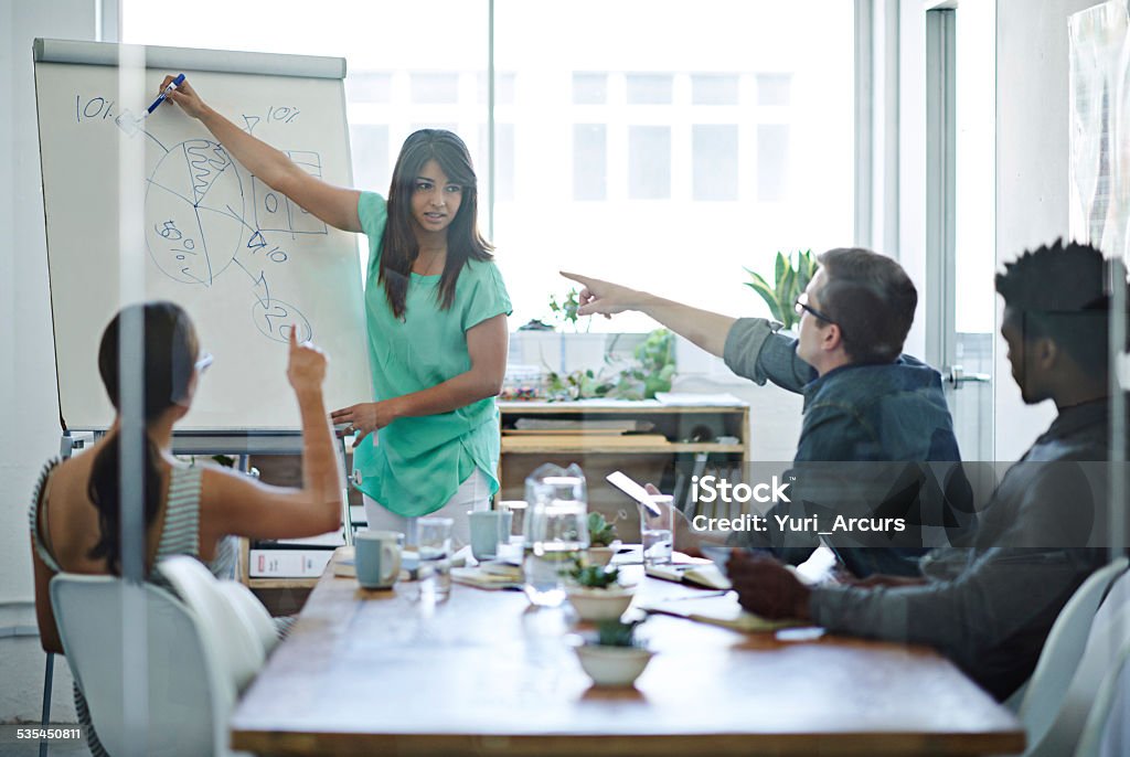 Putting in some valuable input Shot of young businesspeople in deep discussion during a boardroom presentation http://195.154.178.81/DATA/istock_collage/0/shoots/784885.jpg 2015 Stock Photo