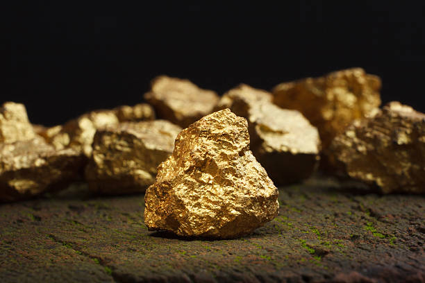 nugget gold Closeup of big gold nugget gold mine stock pictures, royalty-free photos & images