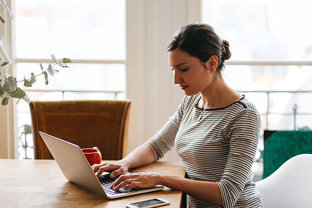 istock Young woman working in her Parisian apartment 535451676