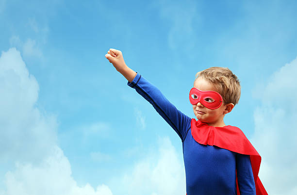 istock Boy in red superhero cape and mask 535451901