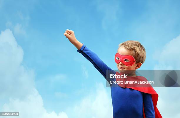 Boy In Red Superhero Cape And Mask Stock Photo - Download Image Now - Superhero, Blue, Cape - Garment