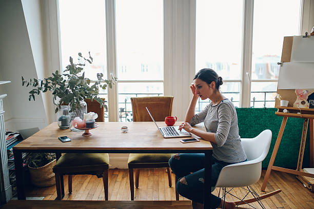 istock Young woman working in her Parisian apartment workspace 535451930