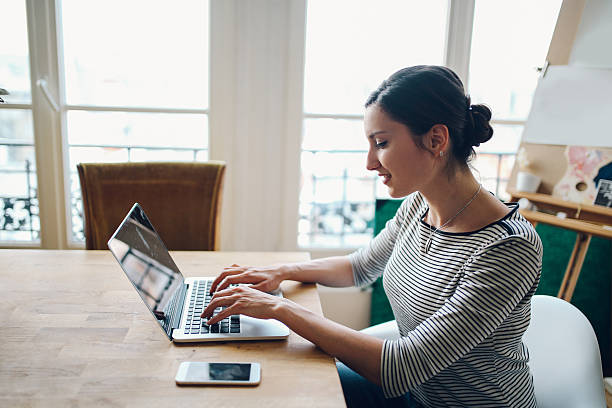 istock Young woman working in her Parisian apartment workspace 535452076