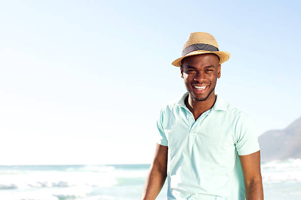 istock Cool young african man with hat at the beach 535452618