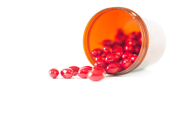 istock Red tablet and medicine brown bottle 535453487