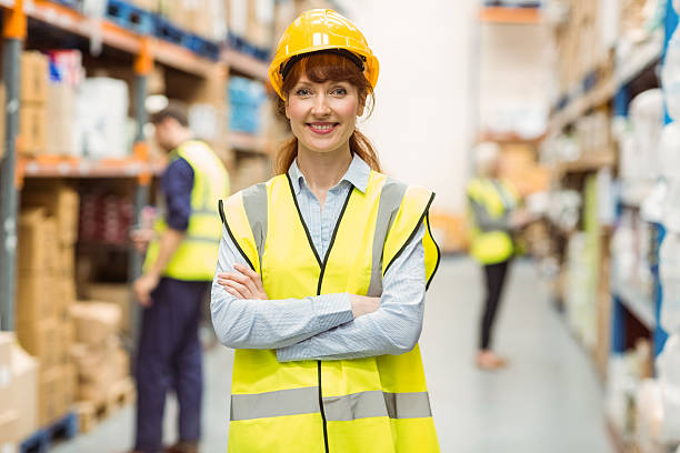 istock Warehouse manager smiling at camera with arms crossed 535454749