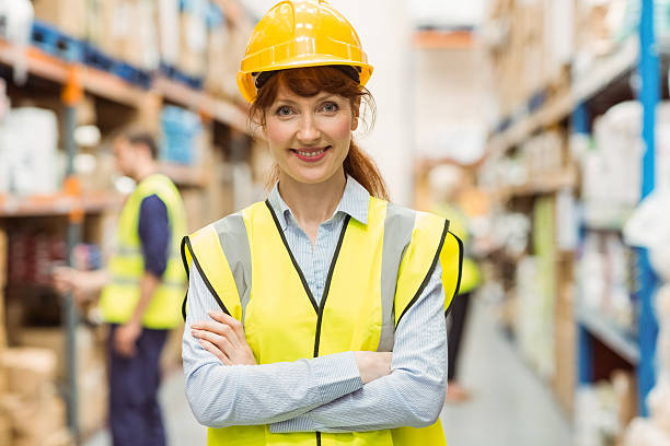 istock Warehouse manager smiling at camera with arms crossed 535454753