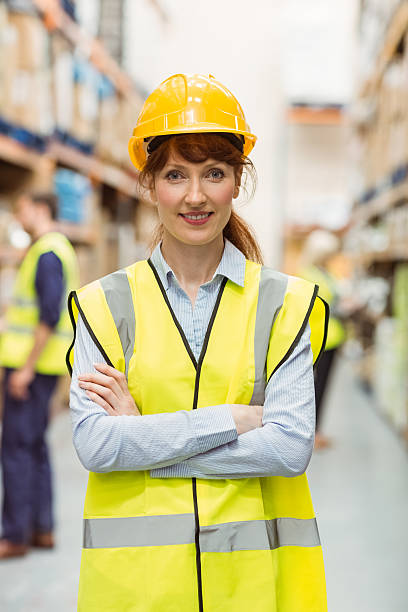 istock Warehouse manager smiling at camera with arms crossed 535454761