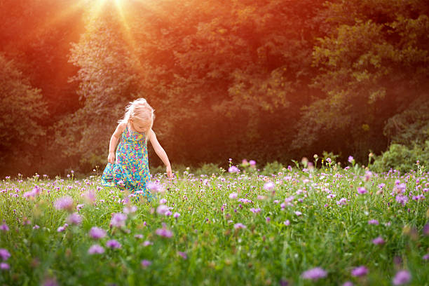 istock Girl having fun playing outdoors during sunny summer afternoon 535454782