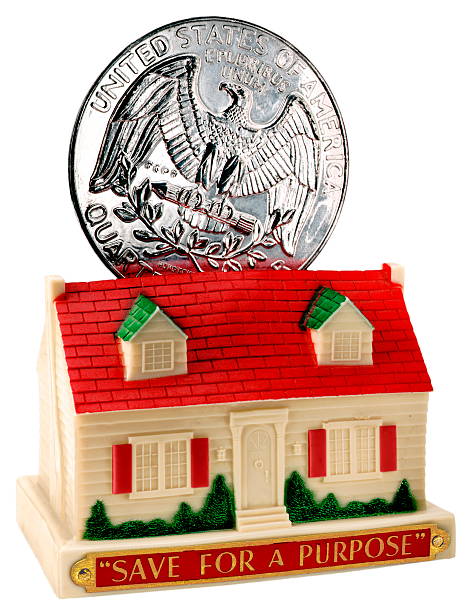 istock Coin Going into House Bank 535455247